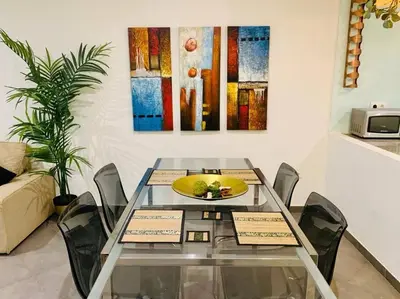 a living room with a couch and a table at La Primera de Occidente in Cádiz
