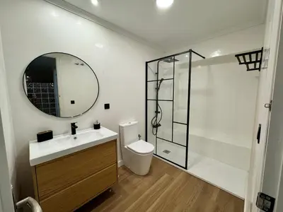 a bathroom with a toilet and a sink and a shower at La Primera de Occidente in Cádiz