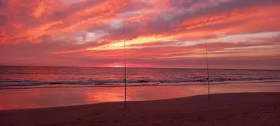 two goals on the beach with a sunset in the background at Villa Antonia in Chipiona