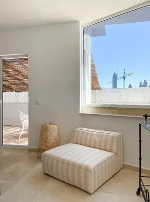 a living room with a couch in front of a window at INFINITY Sunny Home by Cadiz4Rentals in Cádiz