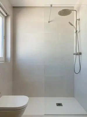 a white bathroom with a shower and a toilet at INFINITY Sunny Home by Cadiz4Rentals in Cádiz