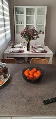 a table with a bowl of oranges on it at Estupendo Piso Nuevo en Playa Victoria in Cádiz