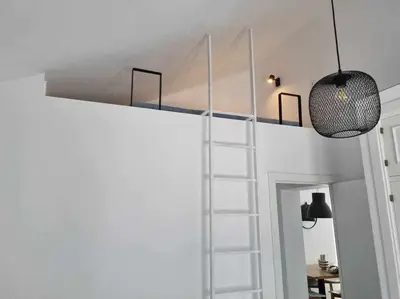 a white bunk bed with a ladder in a room at Villa Yoli 26 con Piscina y Jardin cerca de la Playa in Chiclana de la Frontera