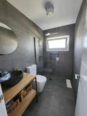 a bathroom with a sink and a toilet at Villa Yoli 26 con Piscina y Jardin cerca de la Playa in Chiclana de la Frontera