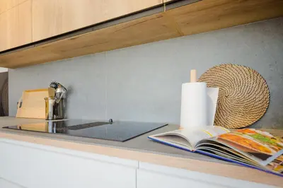 a kitchen counter with a book and a roll of paper towels at Villa Minerva in Chiclana de la Frontera