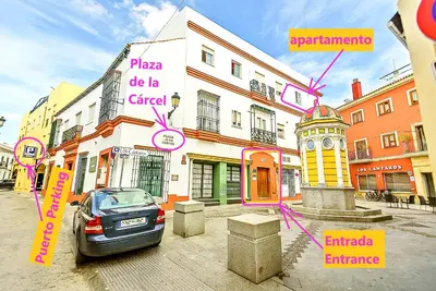 a street with a car parked in front of a building at Plaza de Cárcel 3-bedroom Apartment in El Puerto de Santa María