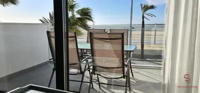 a balcony with chairs and a view of the beach at Arenas de Doñana by Sanlúcar Housing in Sanlúcar de Barrameda