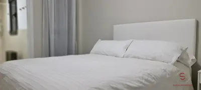 a white bed with white sheets and pillows at Arenas de Doñana by Sanlúcar Housing in Sanlúcar de Barrameda