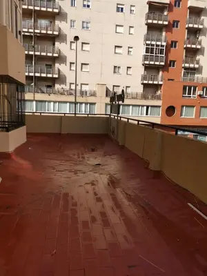 an empty balcony of a building with tall buildings at Apartamento Cream MRZ Rentals in Jerez de la Frontera