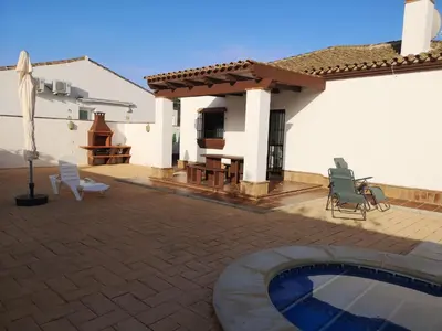 a house with a patio and a swimming pool at Casa Alma in Conil de la Frontera