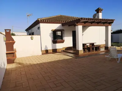 a white house with a patio in front of it at Casa Alma in Conil de la Frontera