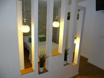 a living room with a couch and a white coffee table at Casas jerezanas Loft Olivier in Jerez de la Frontera
