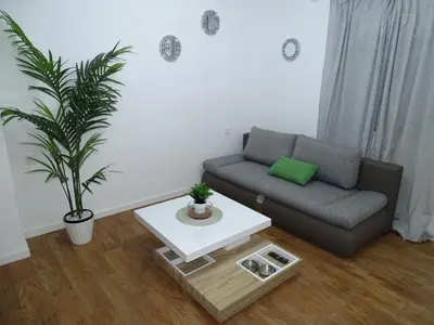 a living room with a couch and a coffee table at Casas jerezanas Loft Olivier in Jerez de la Frontera