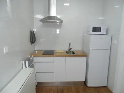 a bedroom with a bed and a living room at Casas jerezanas Loft Olivier in Jerez de la Frontera