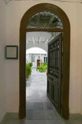 an entrance to a building with an open door at La Fuente Apartamento Jerez in Jerez de la Frontera
