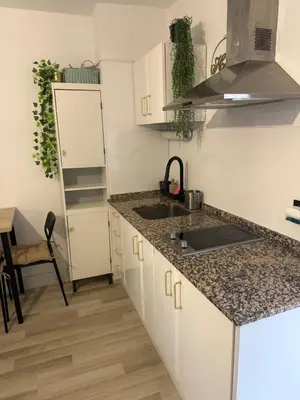 a kitchen with a sink and a counter top at Valdelagrana vistas al mar, piscinas primera linea cadiz in El Puerto de Santa María