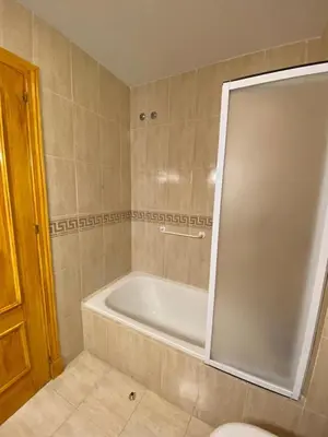 a bathroom with a tub and a toilet in it at Apartamento Costa de la Luz - Parking y Terraza in Chipiona