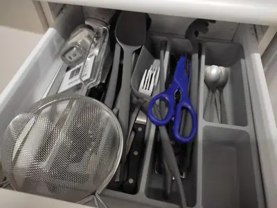 a drawer filled with kitchen utensils and a fan at El Tabanquito in Jerez de la Frontera