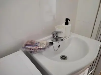 a white sink with a faucet on a counter at El Tabanquito in Jerez de la Frontera