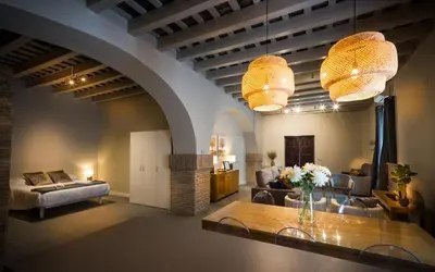 a living room with a couch and a table at LOFT LA CATEDRAL - Parking disponible in Jerez de la Frontera