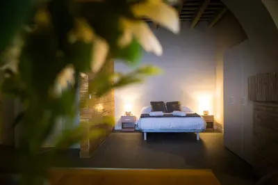 a bedroom with a bed with two pillows on it at LOFT LA CATEDRAL - Parking disponible in Jerez de la Frontera