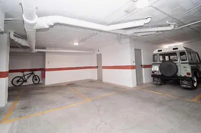 a parking garage with a truck parked in it at Apartamento Montefillo in Sanlúcar de Barrameda