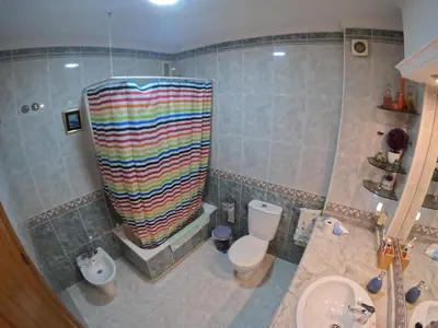 a bathroom with a shower and a toilet and a sink at Comparte Espacio en Chiclana in Chiclana de la Frontera
