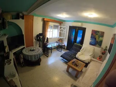 a living room with a couch and a table at Comparte Espacio en Chiclana in Chiclana de la Frontera