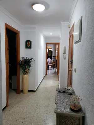 a hallway with a hallway leading to a room at Comparte Espacio en Chiclana in Chiclana de la Frontera