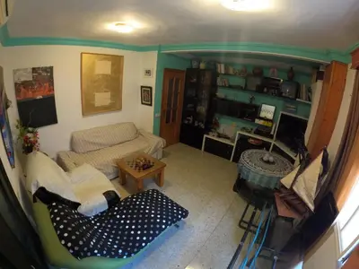 a living room with a couch and a table at Comparte Espacio en Chiclana in Chiclana de la Frontera
