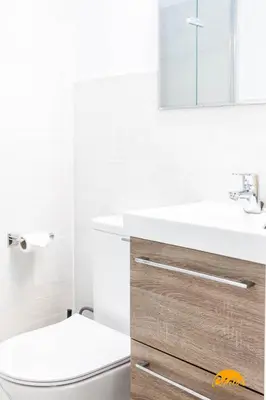 a bathroom with a white sink and a toilet at Nature Home by Cadiz Time in Cádiz