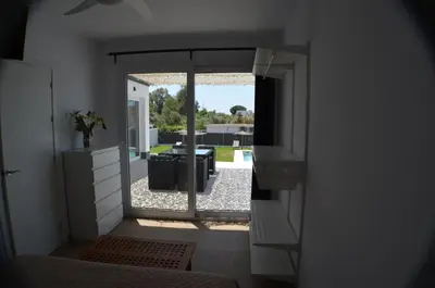 a view of a living room with a view of a patio at EL ENCANTO Chiclana II in Chiclana de la Frontera