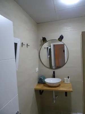 a bathroom with a sink and a mirror at Casasjerezanas Loft Aitana in Jerez de la Frontera