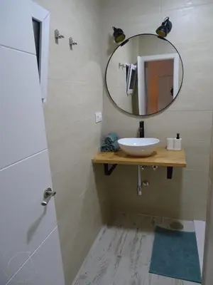 a bathroom with a sink and a mirror at Casasjerezanas Loft Aitana in Jerez de la Frontera