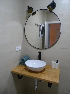 a bathroom with a white sink and a mirror at Casasjerezanas Loft Aitana in Jerez de la Frontera
