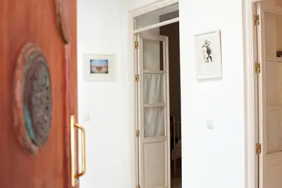 a door leading into a room with a hallway at Barroso 4 by 7Escalones in Rota