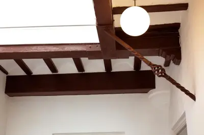 aendant light hanging from the ceiling of a room at Barroso 4 by 7Escalones in Rota