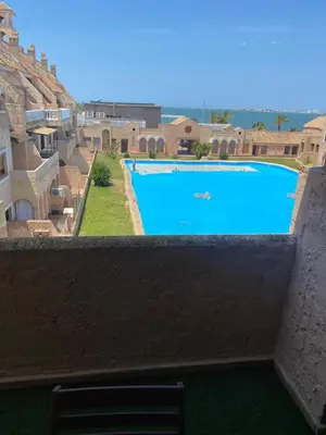 a view from the balcony of a swimming pool at DUPLEX BAHIA SuR RESERVA DE CONFI-ANZA in San Fernando