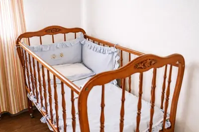 a crib with two pillows in a room at El Mirador del Valle in San Jose del Valle