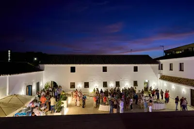 a large group of people standing outside of a building at El Mirador del Valle in San Jose del Valle