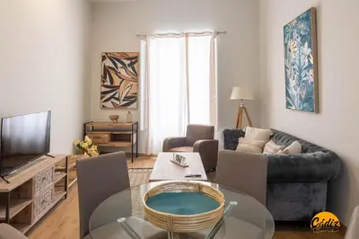 a living room with a couch and a table at Tailor's Home by Cadiz Time in Cádiz