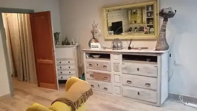 a room with a dresser and a mirror at Oasis de Bornos Chambres in Bornos