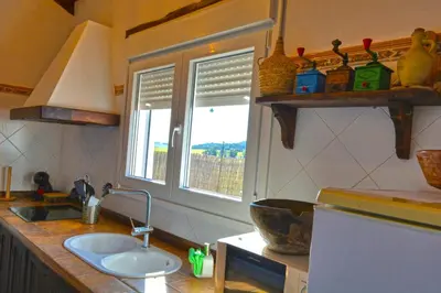 a kitchen with a sink and a window at La Esperanza in Medina Sidonia
