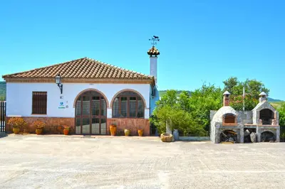 a large white building with a tower on top at La Esperanza in Medina Sidonia