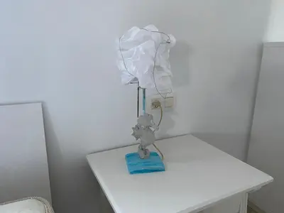 a teddy bear on a white table with a hospitalipment at Ático Cádiz Playa in Cádiz