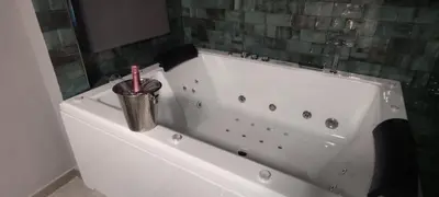 a white bath tub with a toothbrush in it at Latorre jacuzzi jerez in Jerez de la Frontera