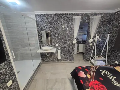 a bathroom with a shower and a sink at Latorre jacuzzi jerez in Jerez de la Frontera
