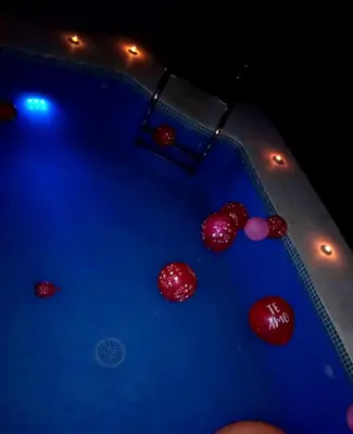 a pool table with red balls on it at night at Casa del abuelo antonioTrujillo in Conil de la Frontera