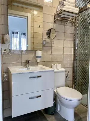 a bathroom with a white sink and a toilet at Anka Kurro in Rota
