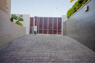 a brick sidewalk in front of a building at La Casa del Mar in Chiclana de la Frontera